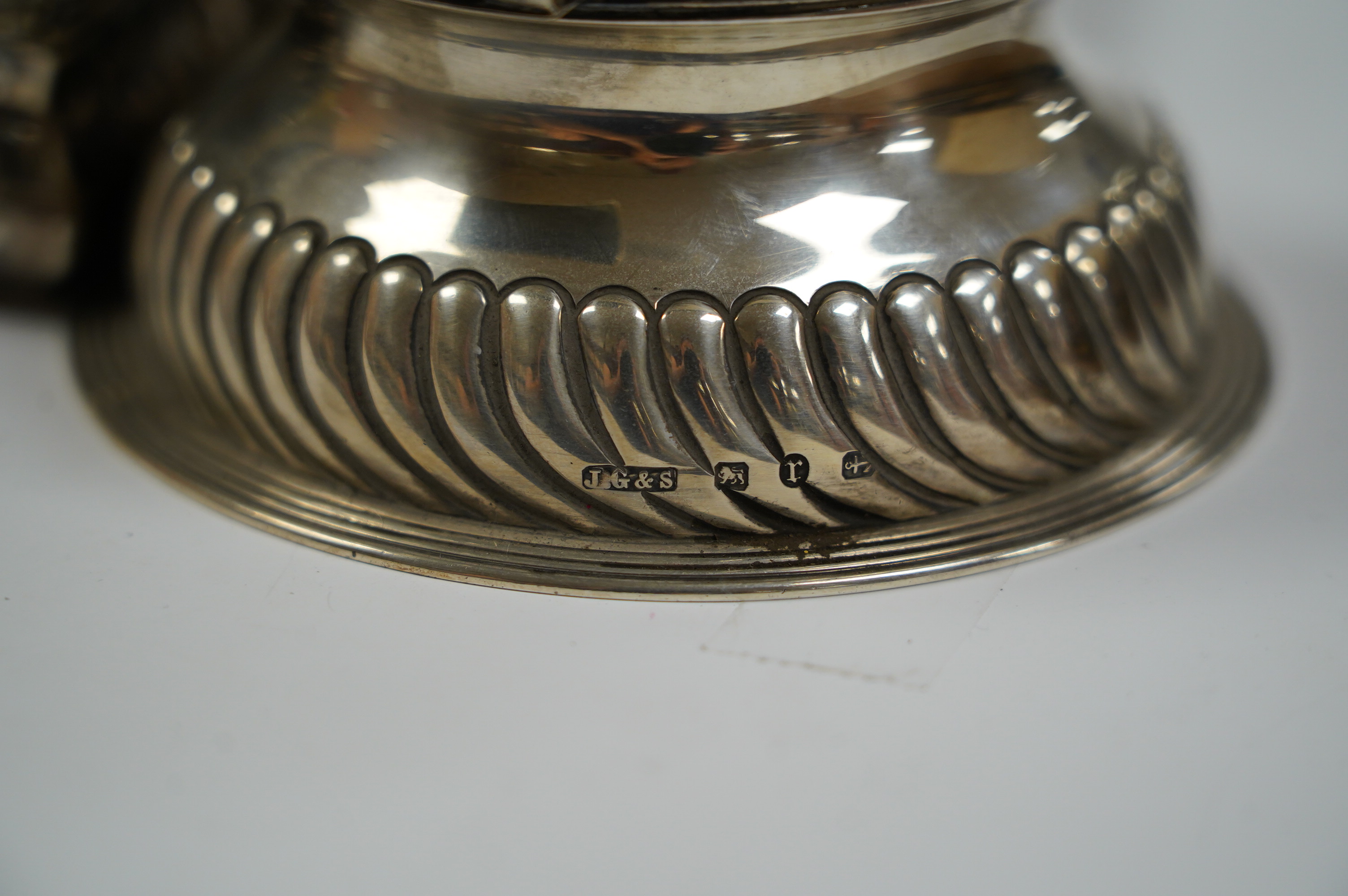 A late Victorian demi-fluted silver circular inkwell, with later engraved inscription, Birmingham, 1891, base diameter 11.4cm and two continental white metal boxes. Condition - poor to fair